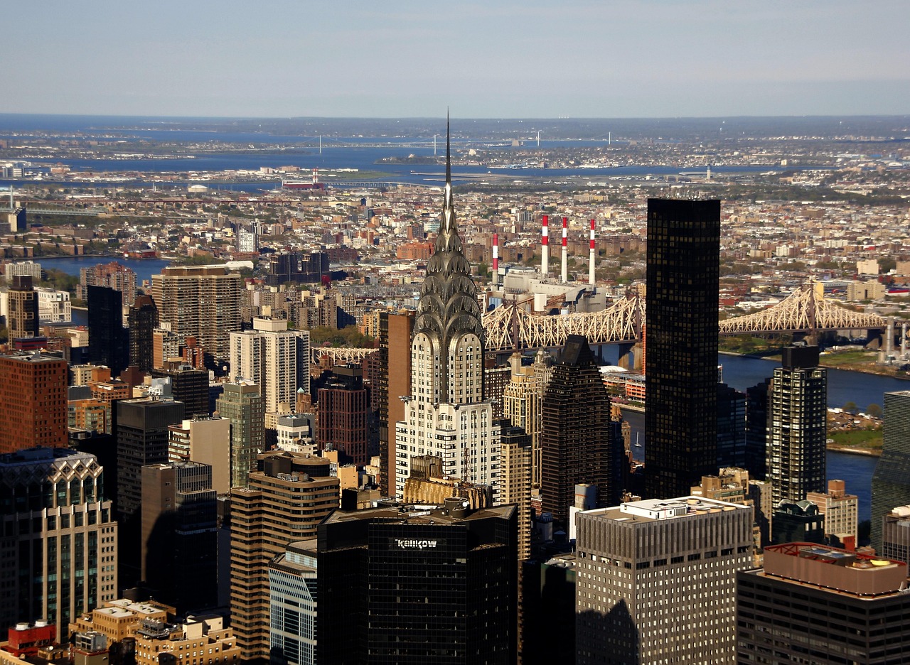 Aerial view of New York City skyline with the Chrysler Building and the Manhattan Bridge.