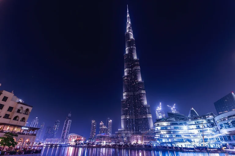 Night view of the Burj Khalifa and surrounding buildings in Dubai, United Arab Emirates.